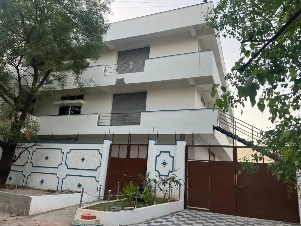 Hyderabad works main entrance — white building with gate and perimeter wall at V.S. Hitech